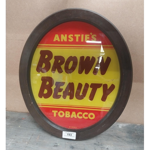 193 - Anstie's Brown Beauty Tobacco reverse painted glass advertising sign {36 cm H x 31 cm W}.