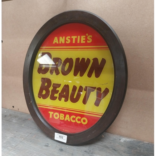 193 - Anstie's Brown Beauty Tobacco reverse painted glass advertising sign {36 cm H x 31 cm W}.