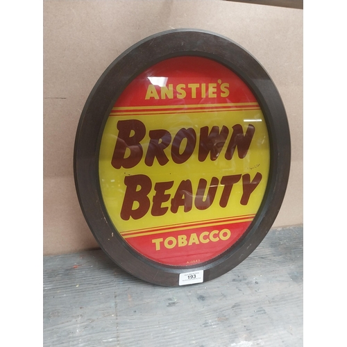 193 - Anstie's Brown Beauty Tobacco reverse painted glass advertising sign {36 cm H x 31 cm W}.