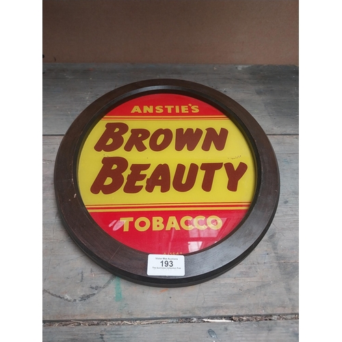 193 - Anstie's Brown Beauty Tobacco reverse painted glass advertising sign {36 cm H x 31 cm W}.