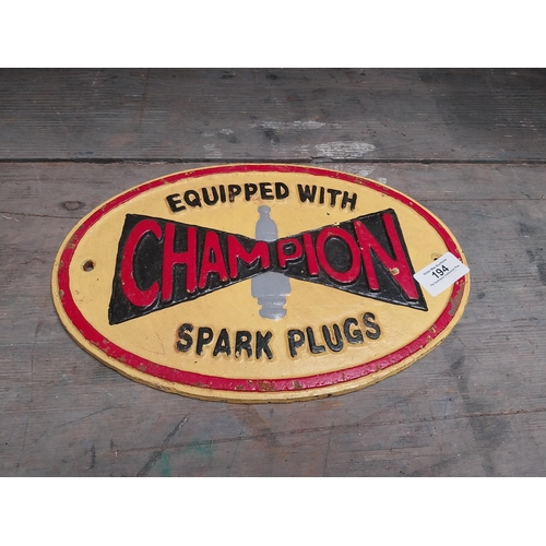 194 - Cast Iron Champion Spark Plugs advertising sign. {20 cm H x 29 cm W}.