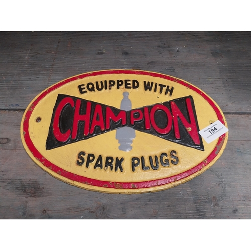 194 - Cast Iron Champion Spark Plugs advertising sign. {20 cm H x 29 cm W}.