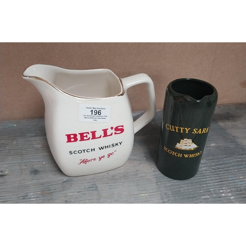 196 - Bells Scotch Whiskey {14 cm H x 19 cm W x 11 cm D} and Cutty Sark Wade 13 cm H x 7 cm W x 7 cm D}.ce... 