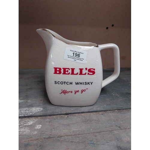 196 - Bells Scotch Whiskey {14 cm H x 19 cm W x 11 cm D} and Cutty Sark Wade 13 cm H x 7 cm W x 7 cm D}.ce... 