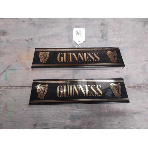 197 - Two Guinness plastic shelf signs. {14 cm W x 4 cm D}.