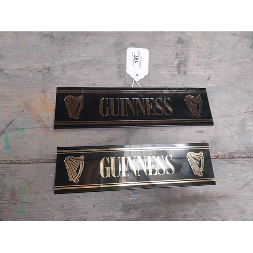 197 - Two Guinness plastic shelf signs. {14 cm W x 4 cm D}.