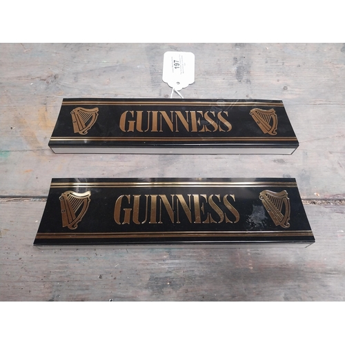 197 - Two Guinness plastic shelf signs. {14 cm W x 4 cm D}.