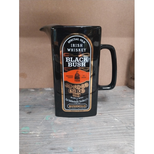 200 - Two Bushmills Black Bush Whiskey ceramic water jugs. {18 cm H x 14 cm W x 8 cm D}.