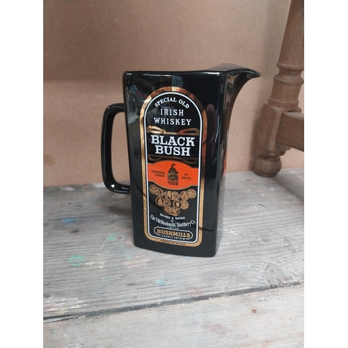 200 - Two Bushmills Black Bush Whiskey ceramic water jugs. {18 cm H x 14 cm W x 8 cm D}.