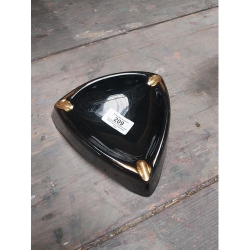 209 - Guinness ashtray {4 cm H x 15 cm W x 15 cm D} and Guinness match strike. {10 cm H x 14 cm Dia.}.