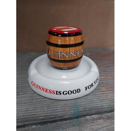 209 - Guinness ashtray {4 cm H x 15 cm W x 15 cm D} and Guinness match strike. {10 cm H x 14 cm Dia.}.