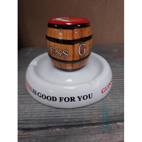 209 - Guinness ashtray {4 cm H x 15 cm W x 15 cm D} and Guinness match strike. {10 cm H x 14 cm Dia.}.