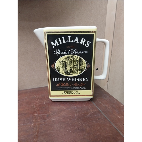 212 - Dunvilles Whiskey Shamrock Lady and Millar's Irish Whiskey ceramic water jugs {15 cm H x 15 cm W x 8... 