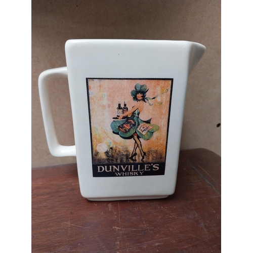 212 - Dunvilles Whiskey Shamrock Lady and Millar's Irish Whiskey ceramic water jugs {15 cm H x 15 cm W x 8... 