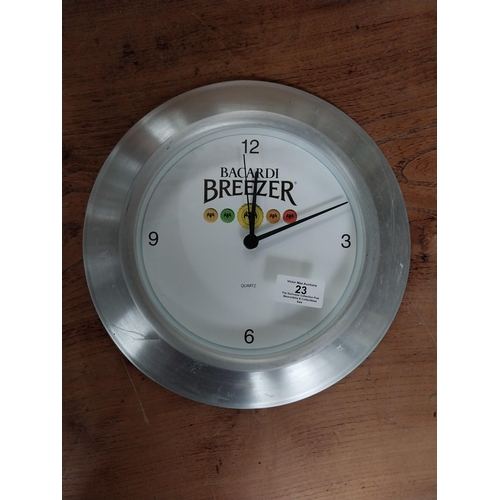 23 - Bacardi Breezer advertising battery clock. {30 cm Dia. }