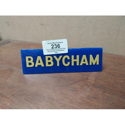 236 - Babycham plastic clip on shelf sign. {4 cm H x 13 cm W}.