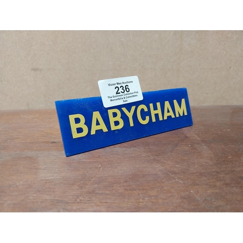 236 - Babycham plastic clip on shelf sign. {4 cm H x 13 cm W}.