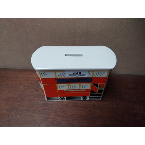 238 - Guinness ceramic money box in form of bus. {10 cm H x 14 cm W x 6 cm D}. PART OF THE DAVID HUGHES CO... 