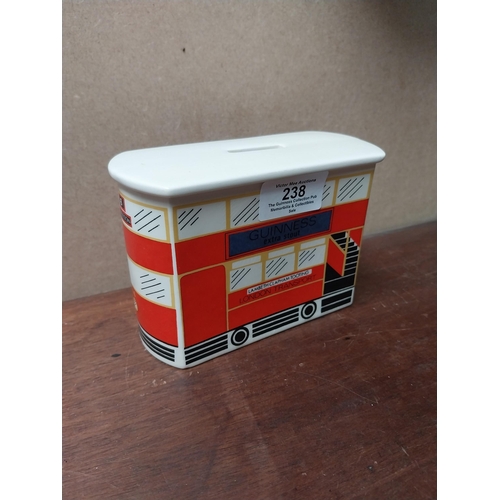 238 - Guinness ceramic money box in form of bus. {10 cm H x 14 cm W x 6 cm D}. PART OF THE DAVID HUGHES CO... 