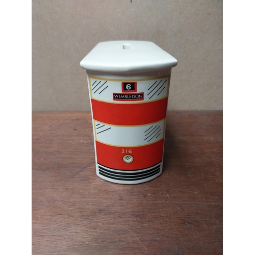 238 - Guinness ceramic money box in form of bus. {10 cm H x 14 cm W x 6 cm D}. PART OF THE DAVID HUGHES CO... 