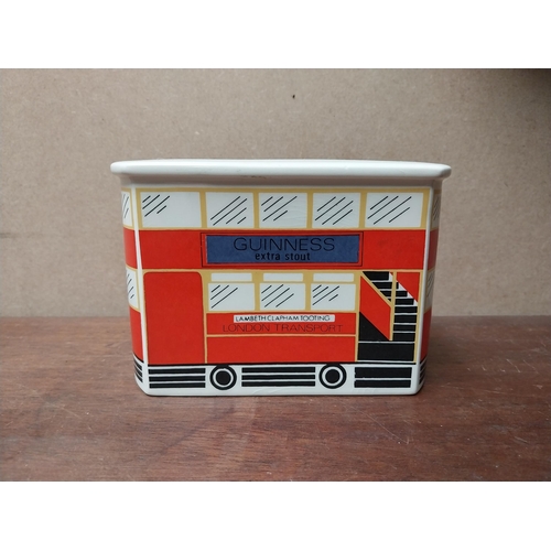 238 - Guinness ceramic money box in form of bus. {10 cm H x 14 cm W x 6 cm D}. PART OF THE DAVID HUGHES CO... 