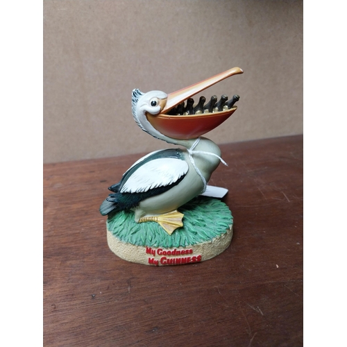 240 - Two Guinness figures Toucan weathervane {17 cm H x 9 cm W x 7 cm D} and ceramic Pelican. {10 cm H x ... 