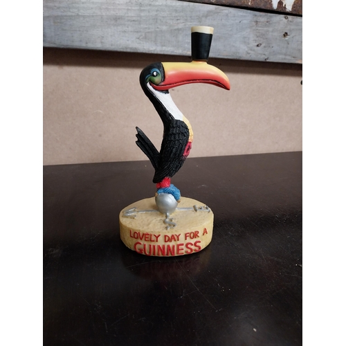 240 - Two Guinness figures Toucan weathervane {17 cm H x 9 cm W x 7 cm D} and ceramic Pelican. {10 cm H x ... 