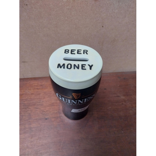 243 - Ceramic money box in form of pint of Guinness Beer Money. {16 cm H x 8 cm Dia.}. PART OF THE DAVID H... 