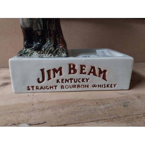 263 - Jim Beam ceramic advertising figure. {33 cm H x 17 cm W x 10 cm D}.