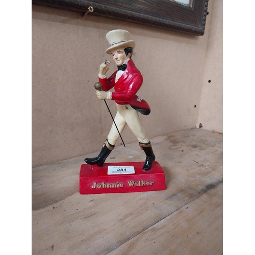 284 - Johnnie Walker composition advertising figure. {20 cm H x 12 cm W x 7 cm D}.