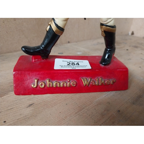 284 - Johnnie Walker composition advertising figure. {20 cm H x 12 cm W x 7 cm D}.