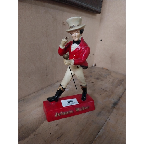 284 - Johnnie Walker composition advertising figure. {20 cm H x 12 cm W x 7 cm D}.