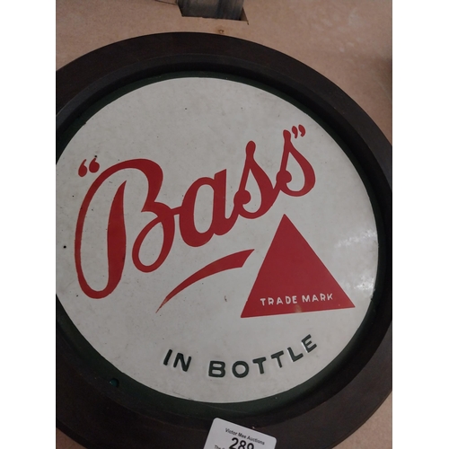 289 - Bass in Bottle framed enamel advertising sign {31 cm H x 31 cm W}.