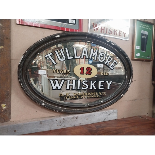 295 - Framed Tullamore Whiskey D E Williams Tullamore oval advertising mirror. {50 cm H x 78 cm W}.