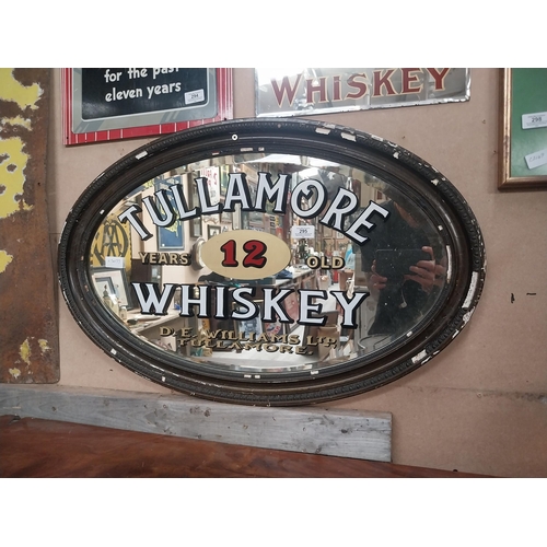 295 - Framed Tullamore Whiskey D E Williams Tullamore oval advertising mirror. {50 cm H x 78 cm W}.