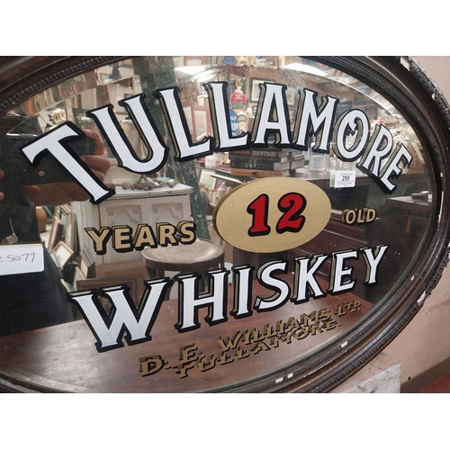 295 - Framed Tullamore Whiskey D E Williams Tullamore oval advertising mirror. {50 cm H x 78 cm W}.