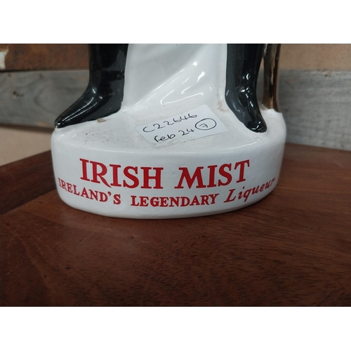 301 - Irish Mist Dragoon ceramic advertising figure. {43 cm H x 13 cm W x 8 cm D}.