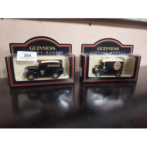 304 - Two cased models of Guinness delivery vans.