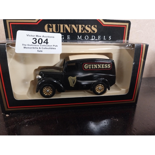 304 - Two cased models of Guinness delivery vans.