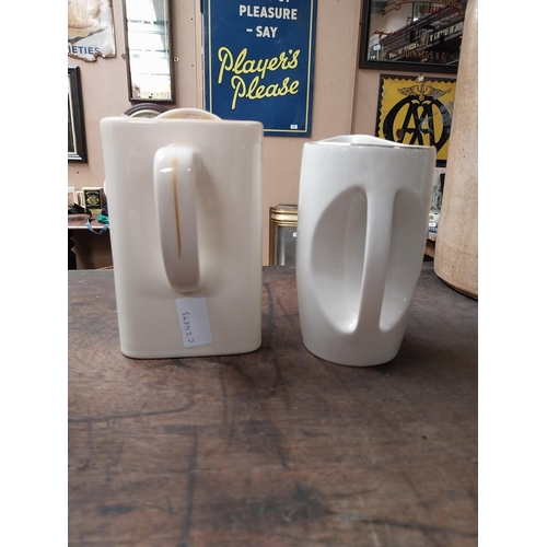 340 - Two Jameson Irish Whiskey ceramic water jugs. {18 cm H x 16 cm W x 10 cm D} and {16 cm H x 11 cm W x... 