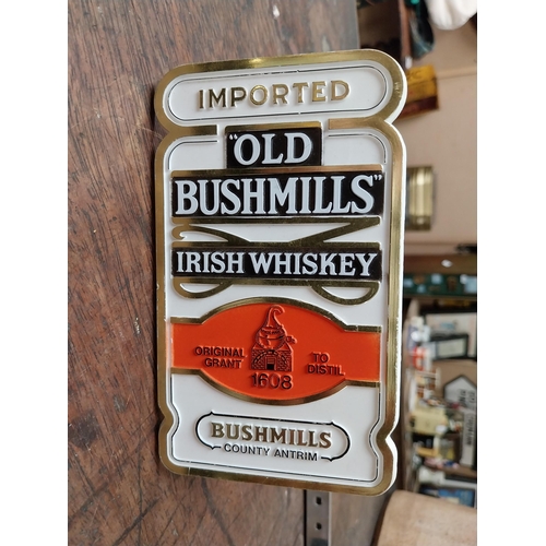 341 - Two optics - Black Bush Whiskey and Bushmills {34 cm H x 16 cm Dia}.