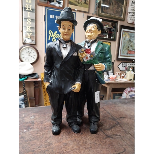 342 - Resin figure of Laurel and Hardy. {25 cm H x 21 cm W}.