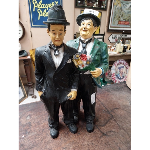 342 - Resin figure of Laurel and Hardy. {25 cm H x 21 cm W}.