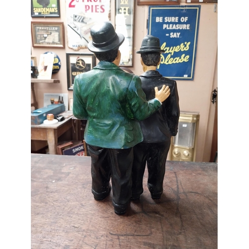 342 - Resin figure of Laurel and Hardy. {25 cm H x 21 cm W}.