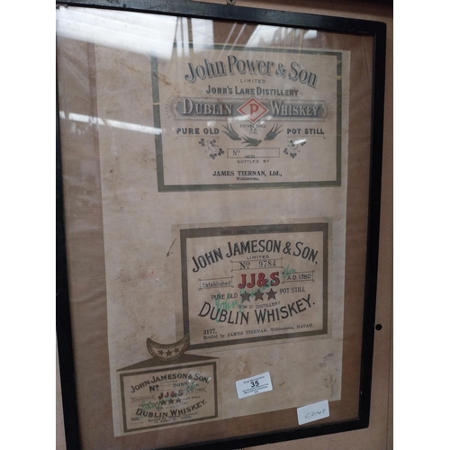 35 - Framed collection of three John Jameson and John Powers Whiskey labels. {44 cm H x 35 cm W}.