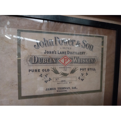 35 - Framed collection of three John Jameson and John Powers Whiskey labels. {44 cm H x 35 cm W}.