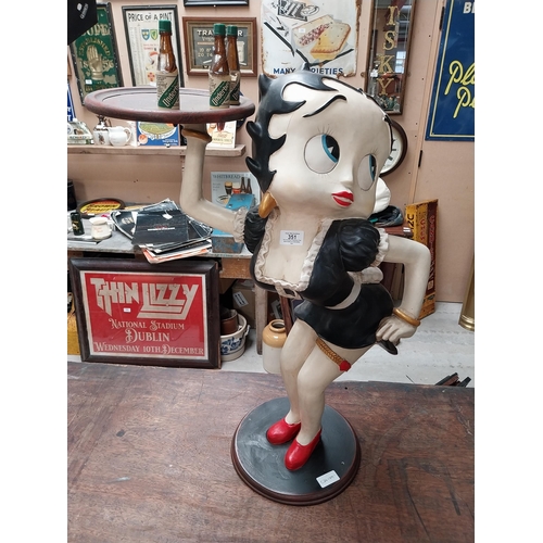 351 - Betty Boop advertising figure on stand with Underberg bottles. {73 cm H x 50 cm W}.