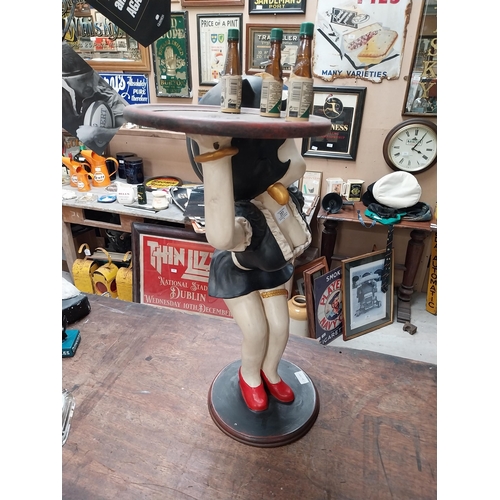 351 - Betty Boop advertising figure on stand with Underberg bottles. {73 cm H x 50 cm W}.