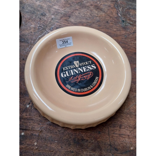 354 - Guinness ceramic ashtray in form of bottle cap {5 cm H x 23 cm Dia.}