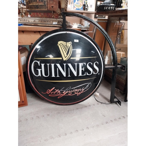 365 - Double sided Guinness light up advertising sign with bracket {62 cm H x 97 cm W}.